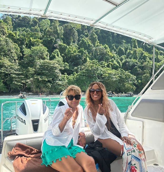 Happy female tourists on cruise ship at Phuket beach