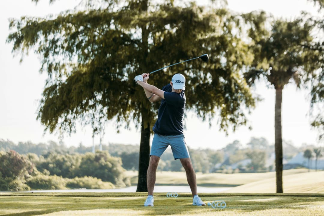 Guy golf swing in motion