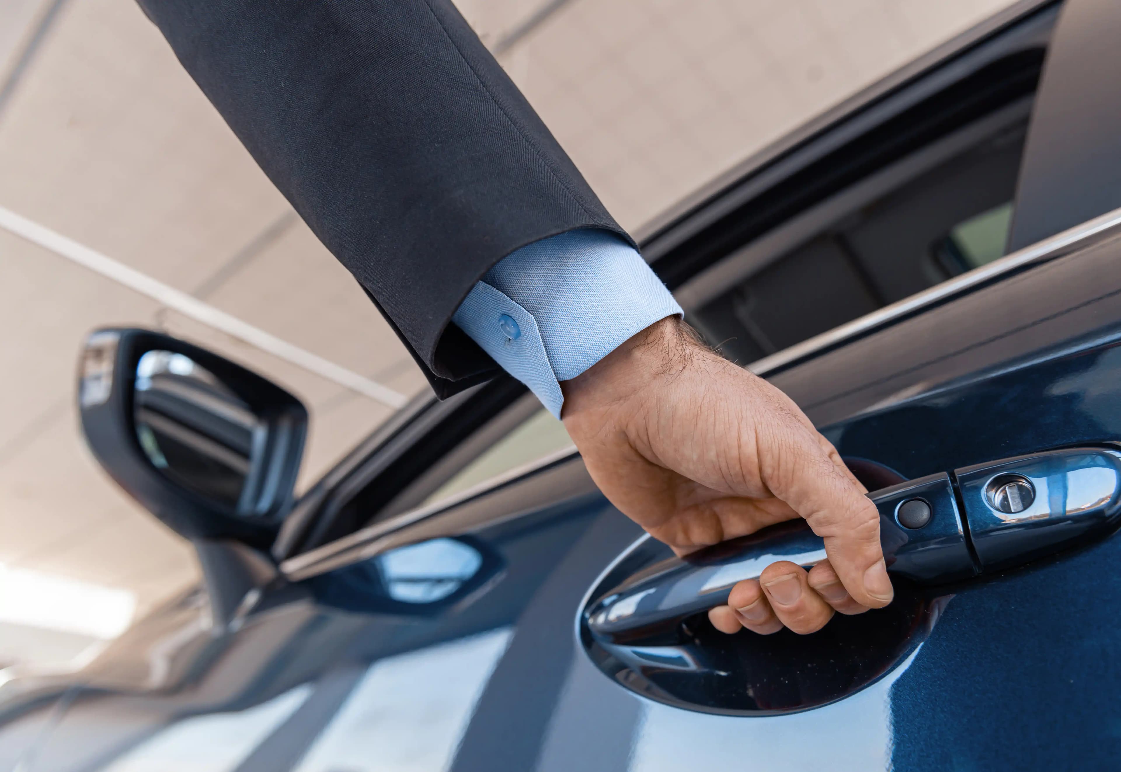close-up-of-a-male-businessman-hand-opening-a-car