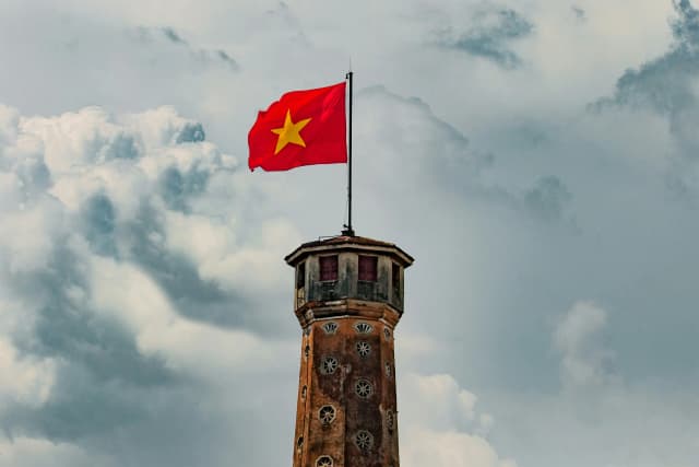Vietnamese flag atop a tower